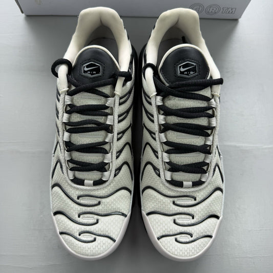 Nike Air Max Plus TN white trainers with black and purple accents, custom writing on bubbles.