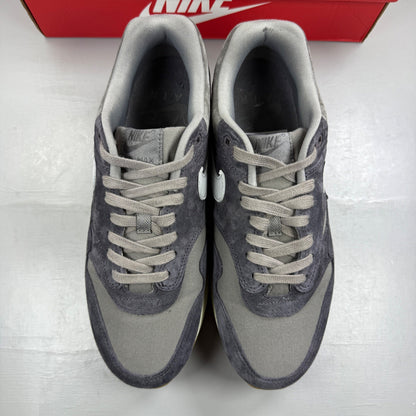 Nike grey deck shoes with premium crepe sole and logo detailing.