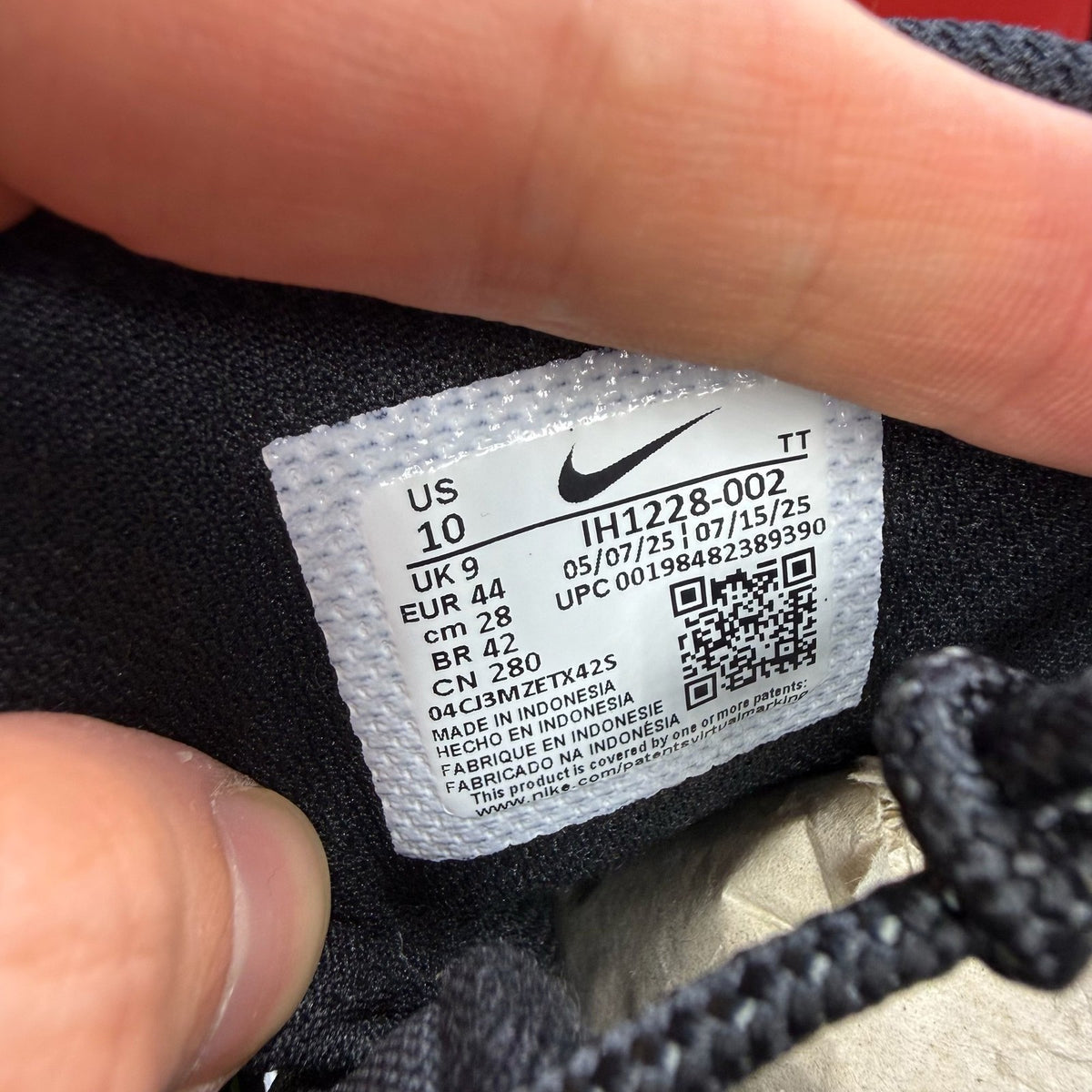 Nike Air Max 95 grey sneaker with big bubble sole and racing pack details.