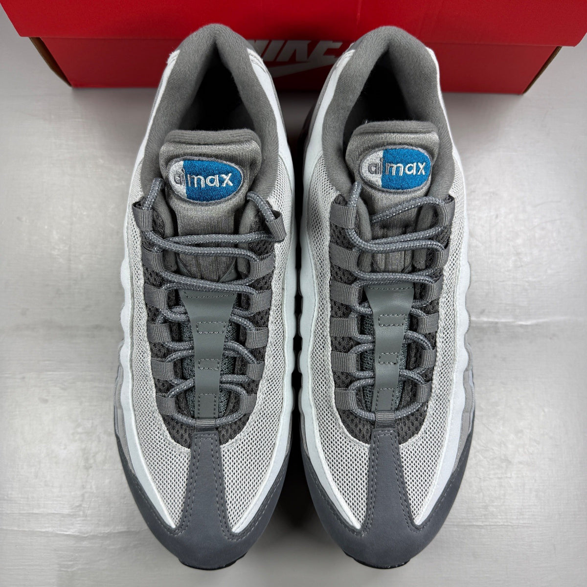 Nike Air Max 95 grey sneaker with big bubble design and green accents.