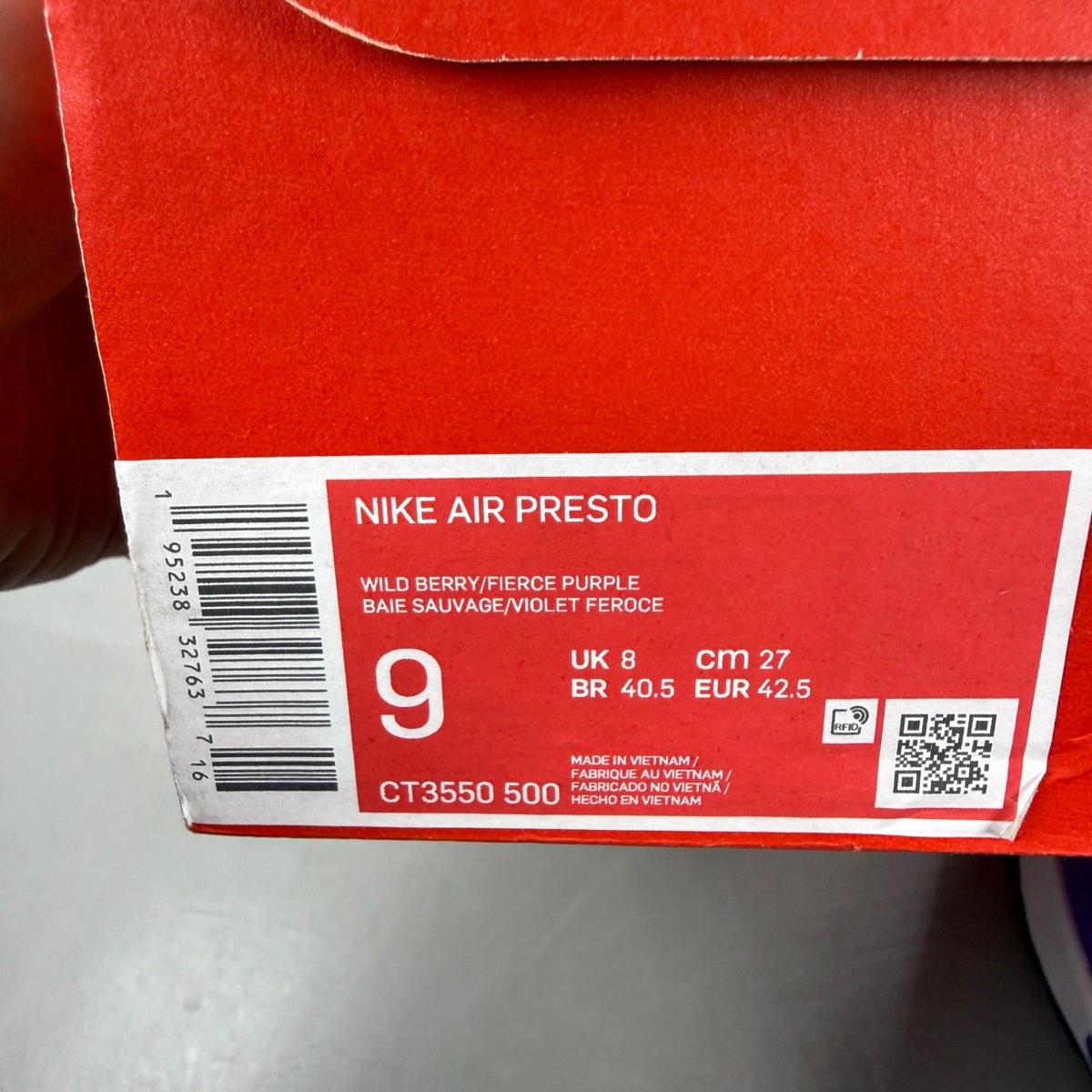 Nike Air Presto purple trainers with mesh upper and distinctive logo detailing.