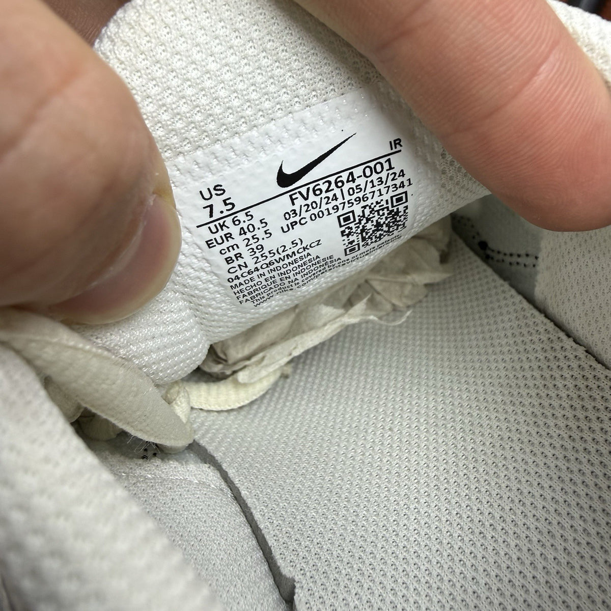 Nike Air Max Plus TN ESS trainers white with black accents and signature swoosh logo.