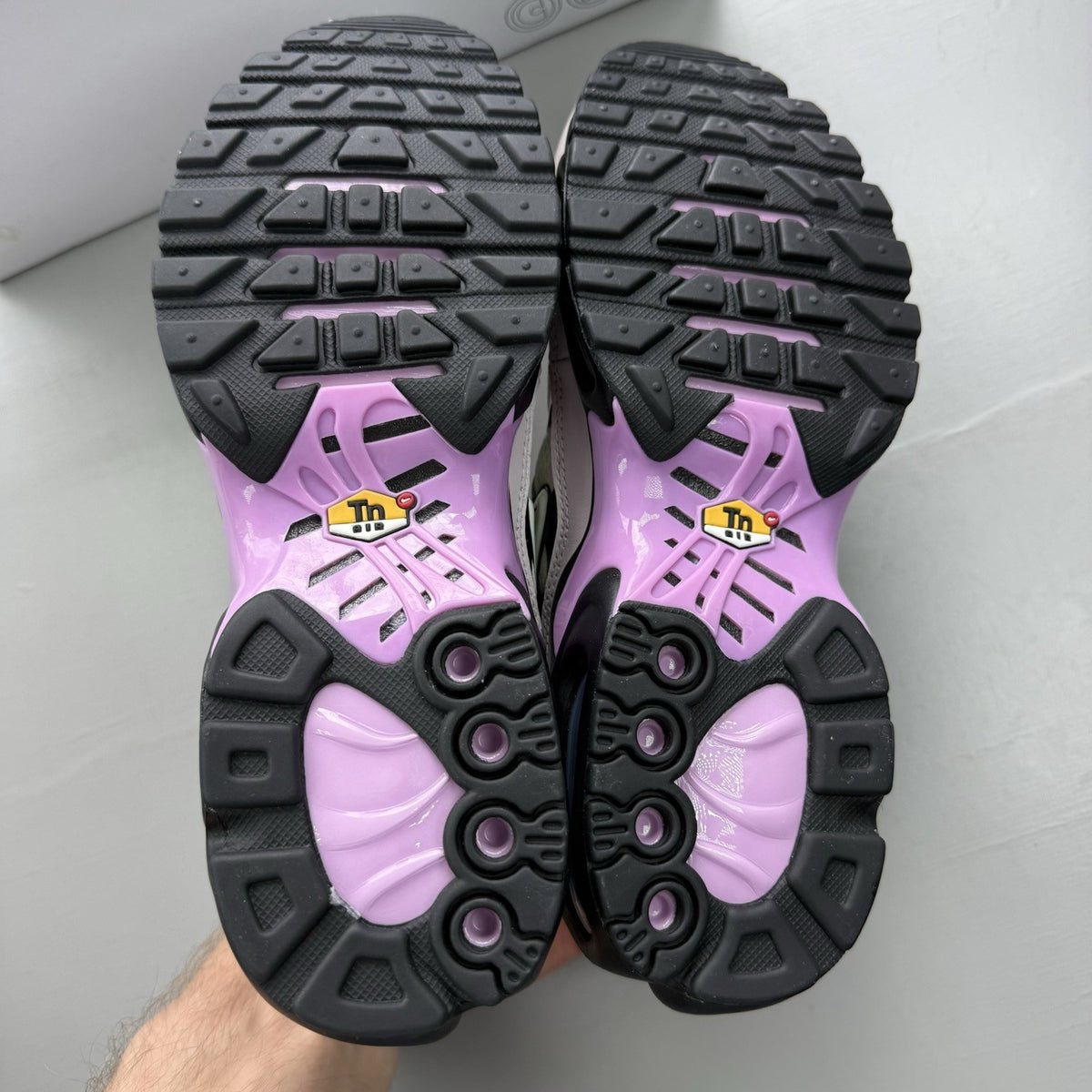 Nike Air Max Plus TN white trainers with black and purple accents, custom writing on bubbles.