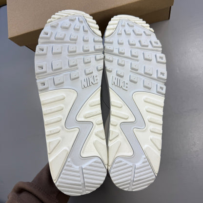 Nike white trainers with lemon venom accents and Air Max logo detail.