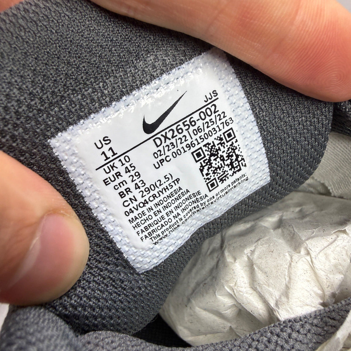 Nike Air Max 90 grey trainers with jewel accents and textured upper.