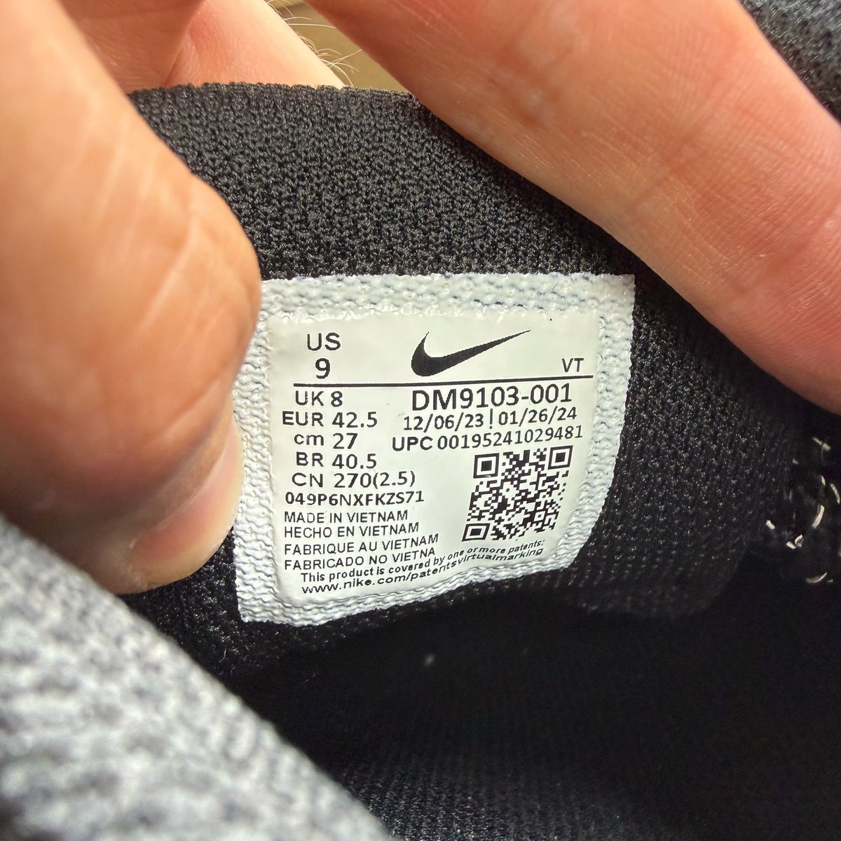 Nike black Air Max 95 trainers with reflective details and logo.