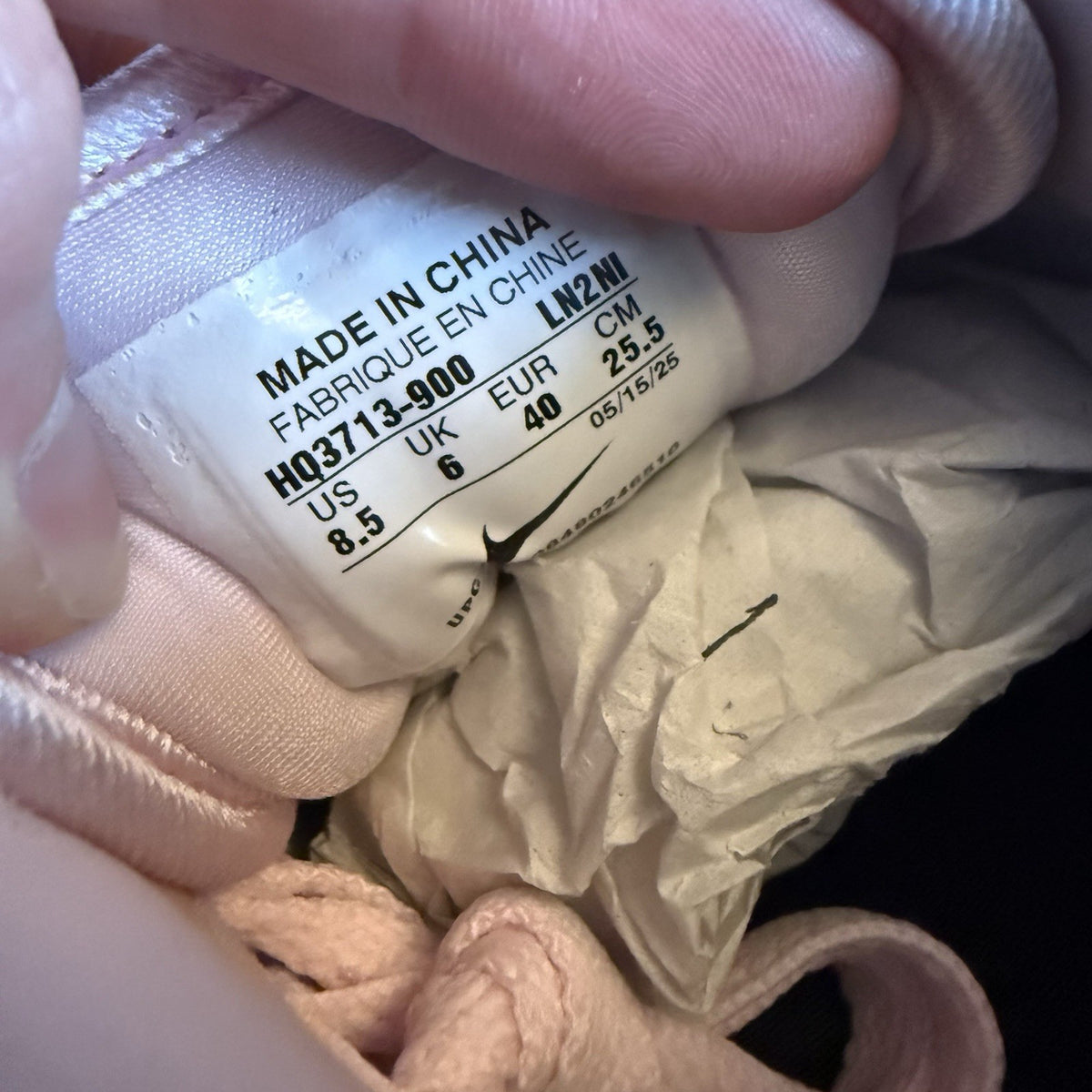 Nike Air Max 1 trainers pink with silver accents and unique design details.