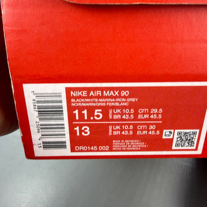 Nike running shoes black with grey accents and logo on the side.