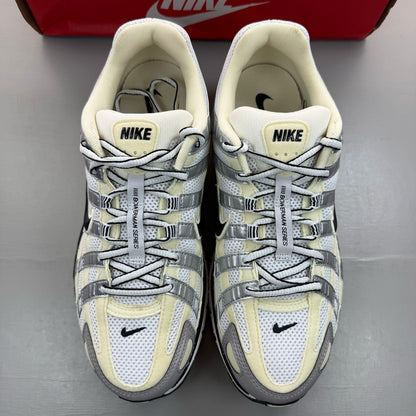 Nike P-6000 white trainers metallic silver accents and mesh detailing.