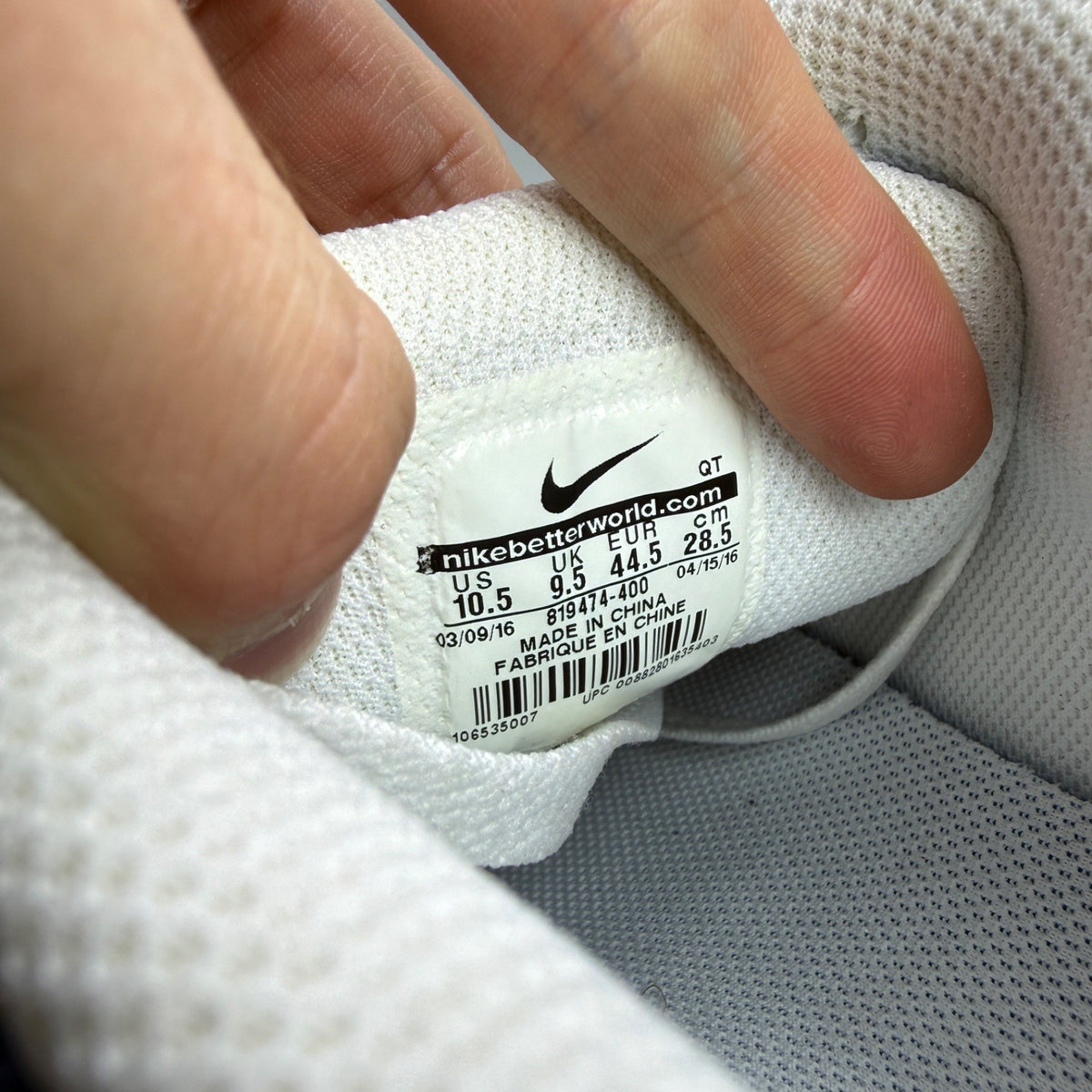 Nike Air Max 90 blue trainers with white accents and signature swoosh logo.