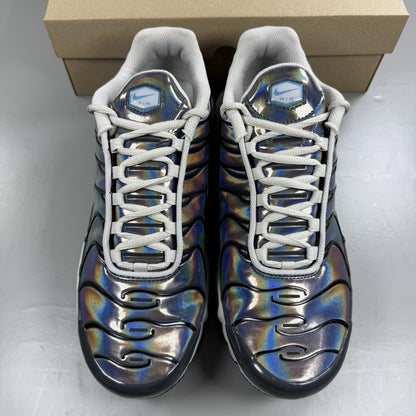 Nike Air Max Plus TN trainers white iridescent finish with signature swoosh logo.