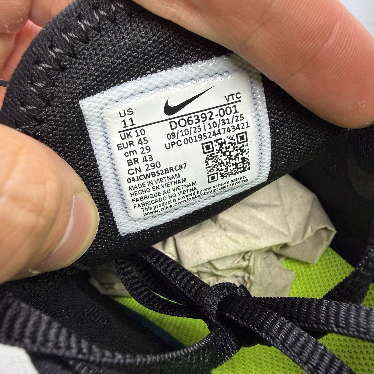 Nike Air Max 270 black trainers with neon volt accents and white sole.