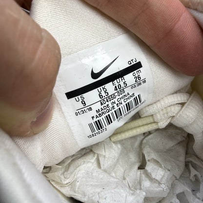 Nike Air VaporMax Plus beige trainers with Phantom Orange accents and distinctive logo.