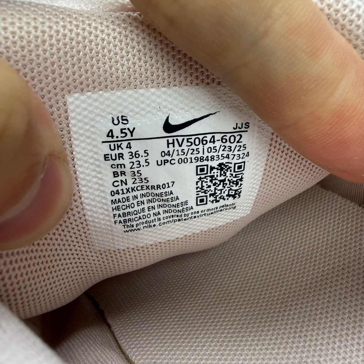 Nike P-6000 pink trainers with mesh upper and logo detailing.