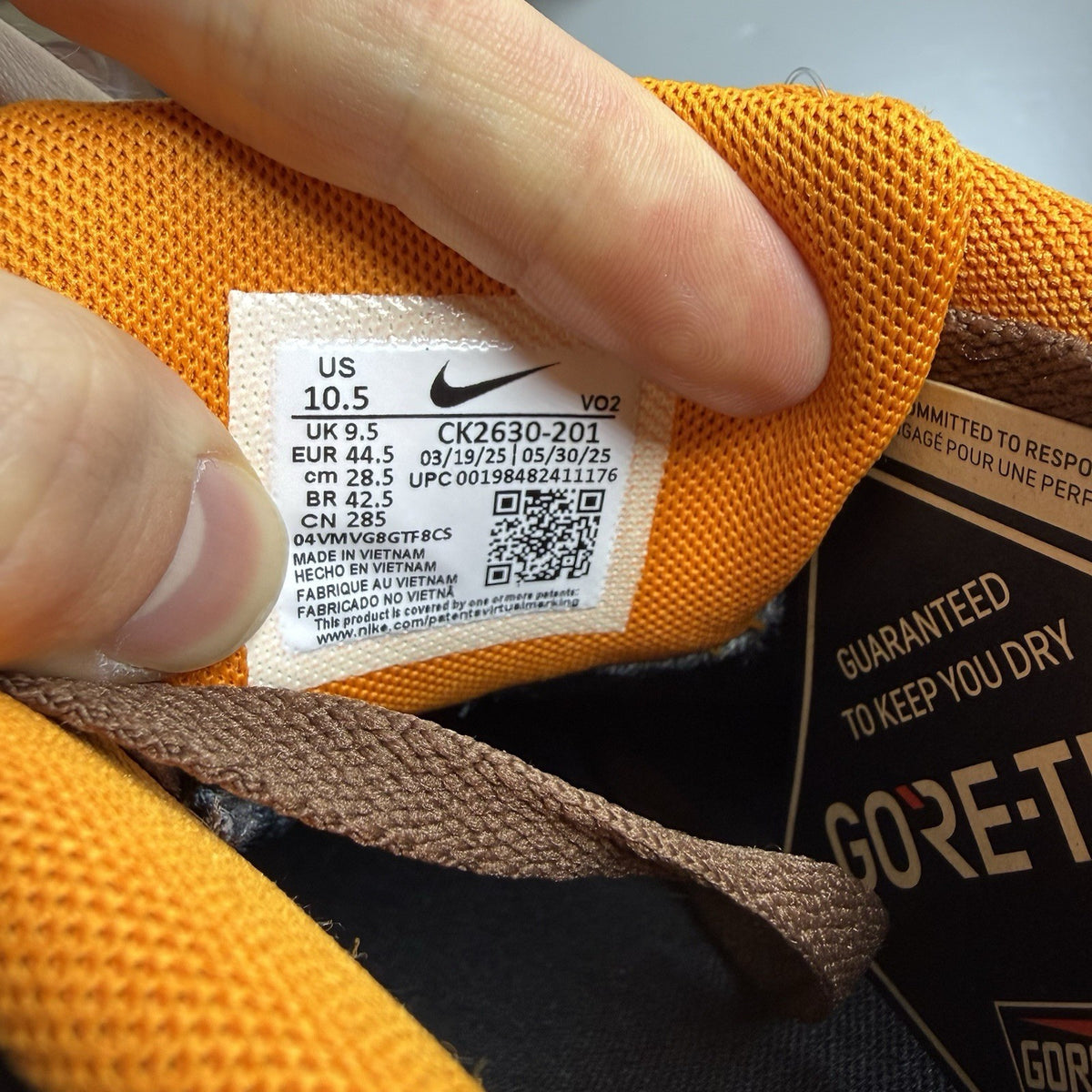 Nike Air Force 1 Low Gore-Tex brown sneaker with bright ceramic accents and logo.
