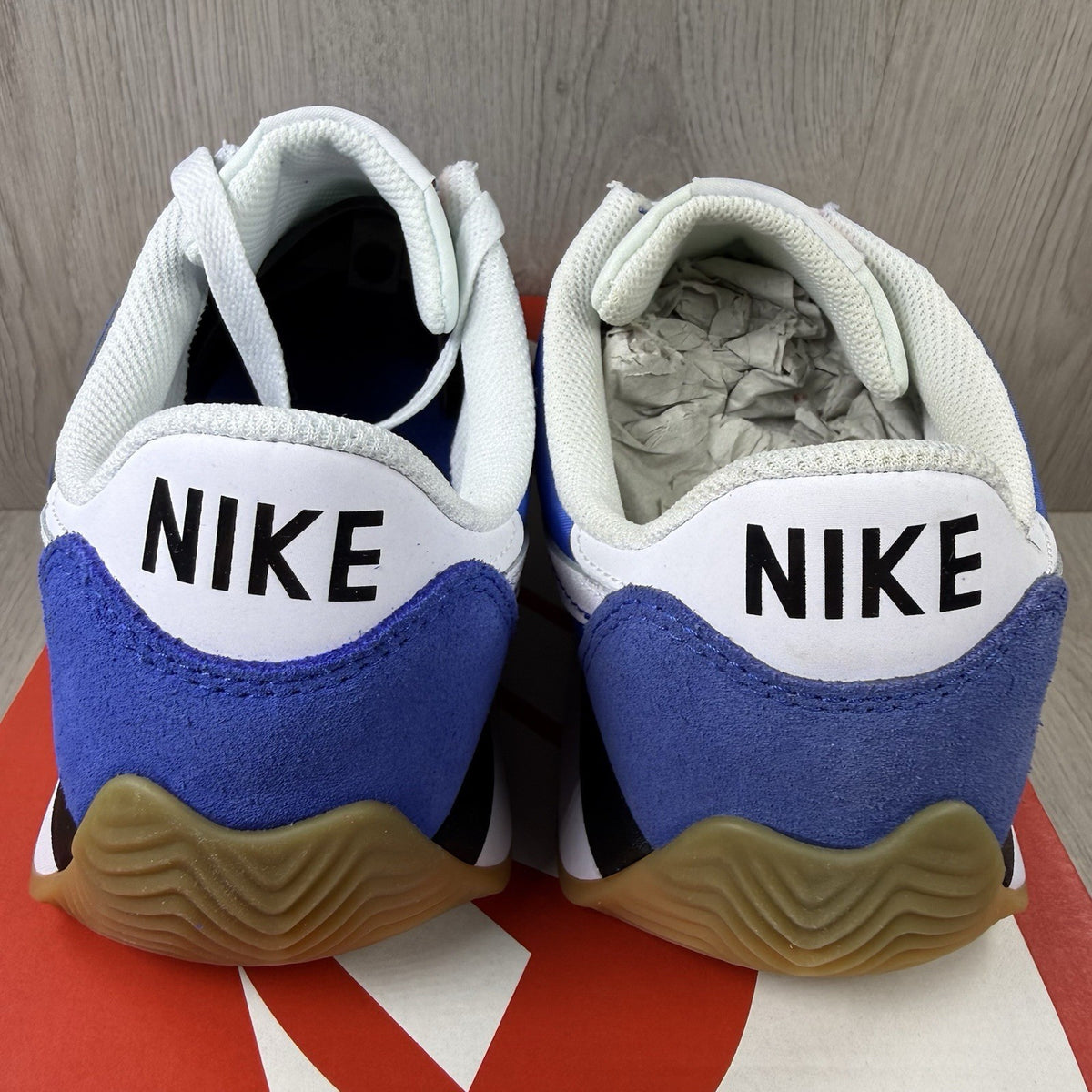 Nike trainers game royal blue with white and black accents, featuring logo detail.