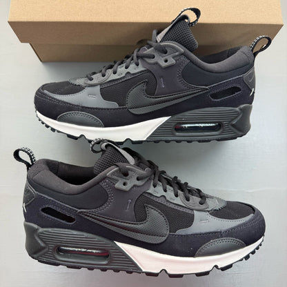Nike black Air Max 90 Futura trainers with grey accents and logo detail.