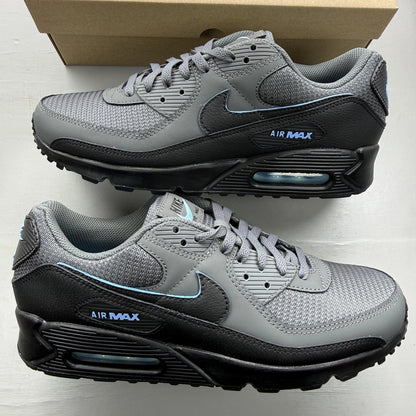 Nike Air Max 90 grey trainers with blue accents and logo detail.