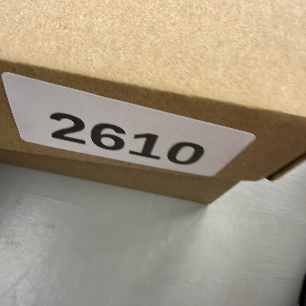 Nike black Air Max 270 trainers with grey and university gold accents, logo on tongue.