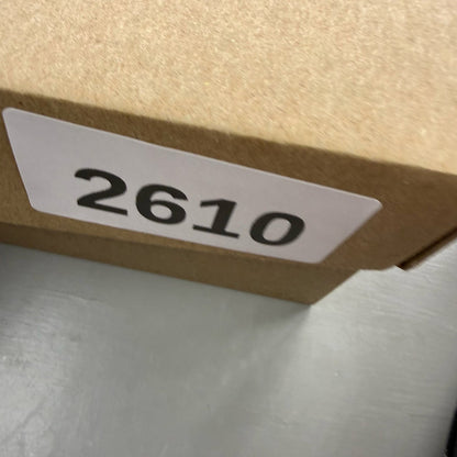 Nike black Air Max 270 trainers with grey and university gold accents, logo on tongue.