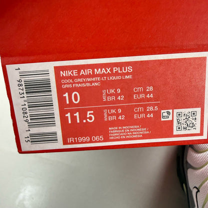 Nike Air Max Plus TN grey trainers with white and liquid lime accents, featuring logo details.