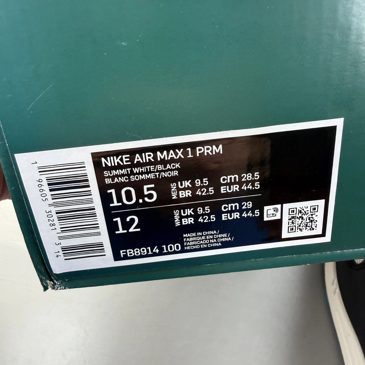 Nike Air Max 1 white trainers with LeBron James logo and Liverpool FC details.