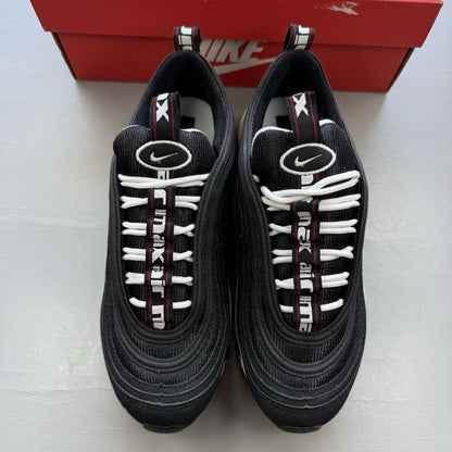 Nike Air Max 97 SE black trainers with white and varsity red accents, mesh and leather material.