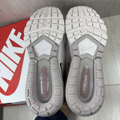 Nike Air Max Pulse purple trainers with unique design and textured material.