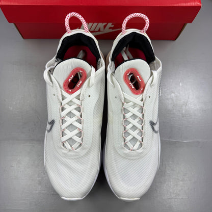 Nike running shoes white with red accents and logo, featuring a sleek design.