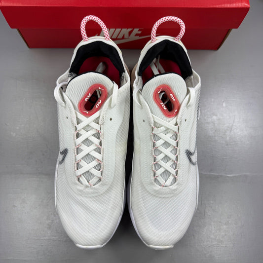 Nike running shoes white with red accents and logo, featuring a sleek design.