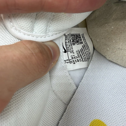 Nike Dunk Low white trainers with yellow gingham pattern and brown gum sole.