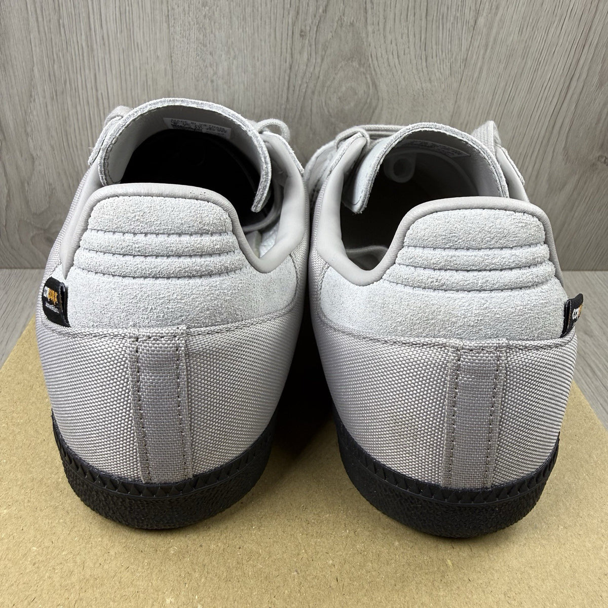 Adidas grey trainers with Cordura material and classic Samba logo detailing.