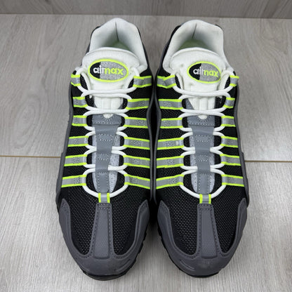 Nike Air Max 95 NDSTRKT black trainers with neon accents and textured mesh upper.