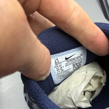 Nike blue deck shoes with logo detail and sleek design.