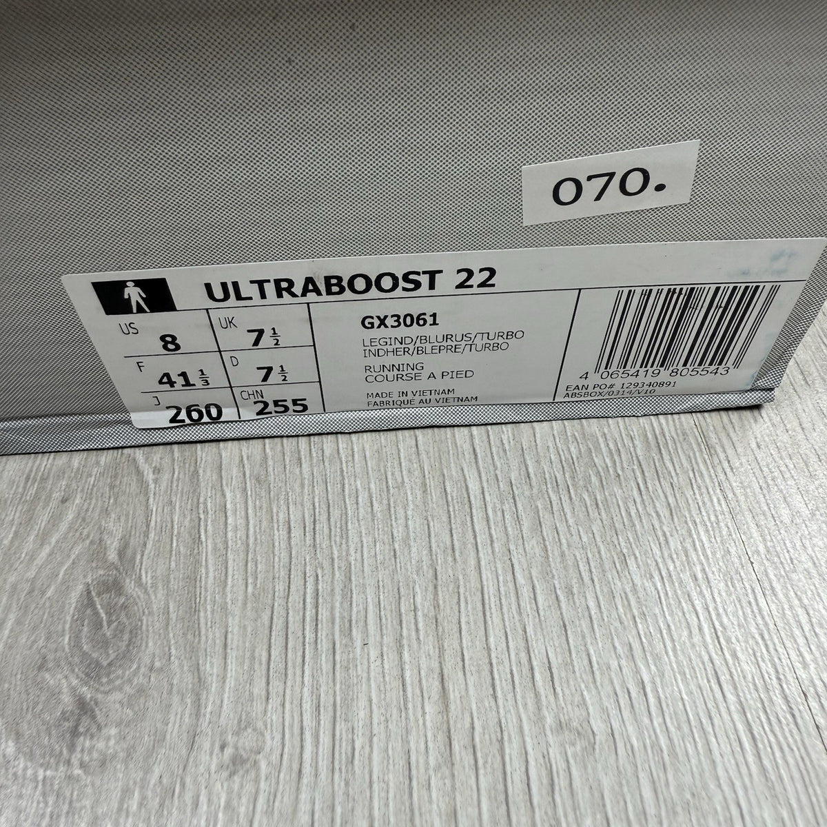 Adidas Ultra Boost 22 trainers in legacy indigo with turbo blue and white accents.