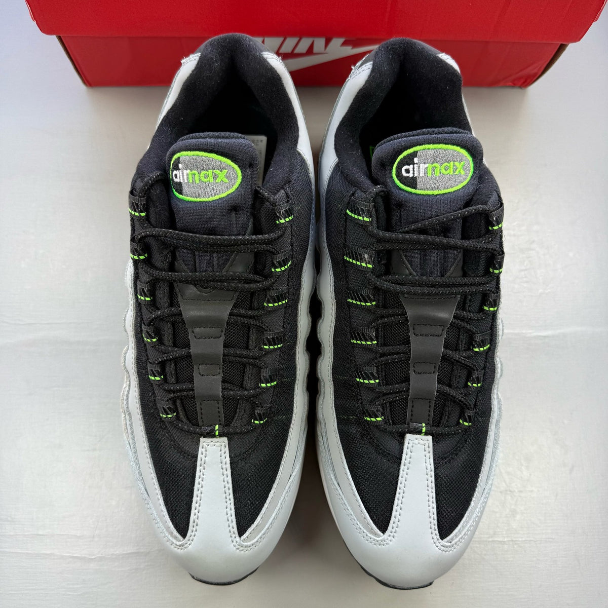 Nike Air Max 95 grey sneaker with big bubble sole and racing pack details.