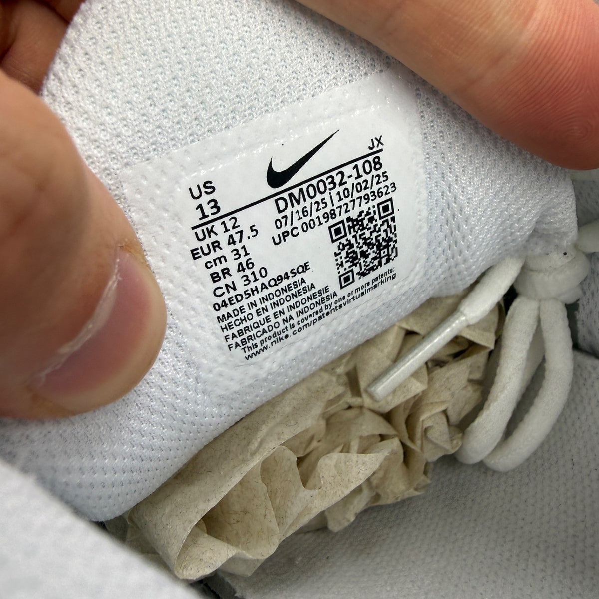 Nike deck shoes white with green and red accents, featuring logo and sleek design.