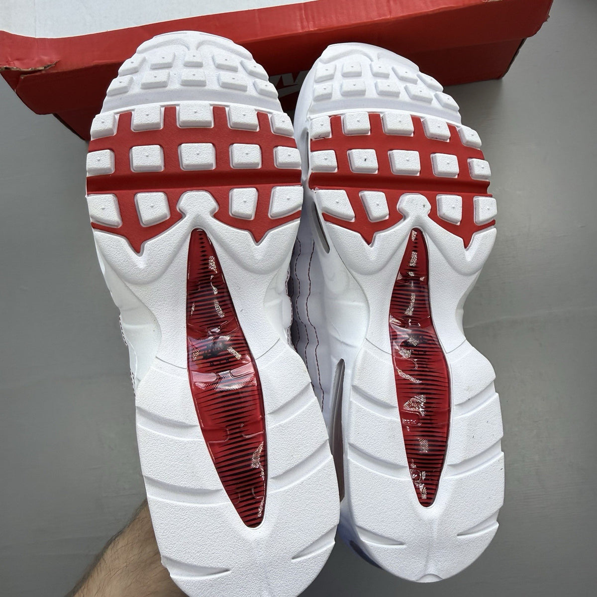 Nike Air Max 95 trainers white with university red accents and signature big bubble sole.