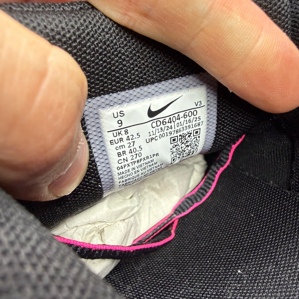 Nike P-6000 trainers black pink metallic detailing and logo accents.
