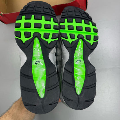 Nike Air Max 95 black trainers with green strike accents and textured upper.