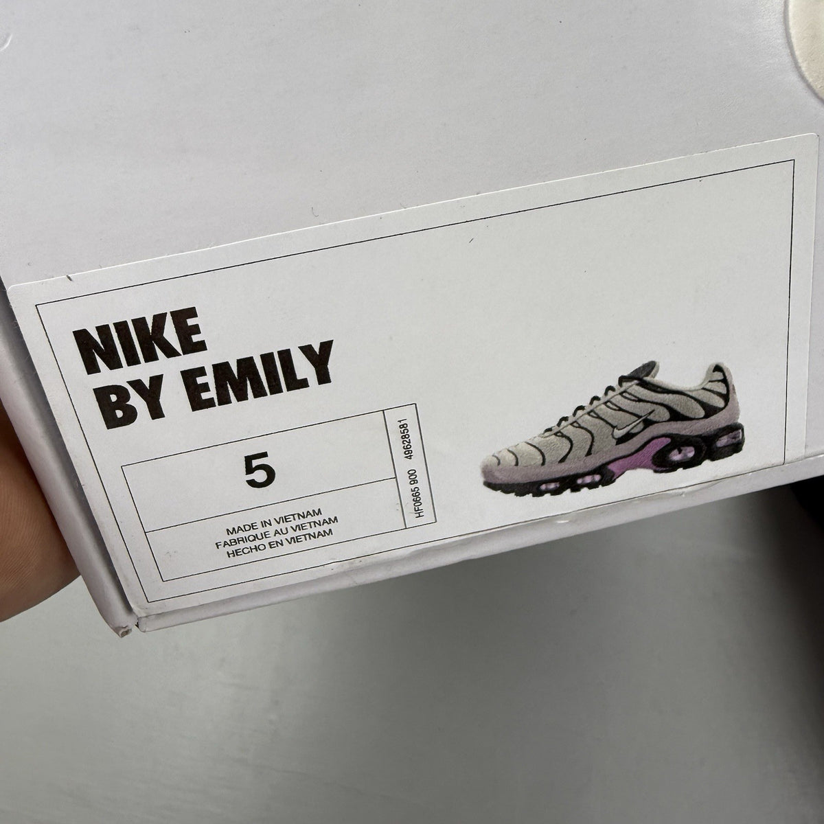 Nike Air Max Plus TN white trainers with black and purple accents, custom writing on bubbles.