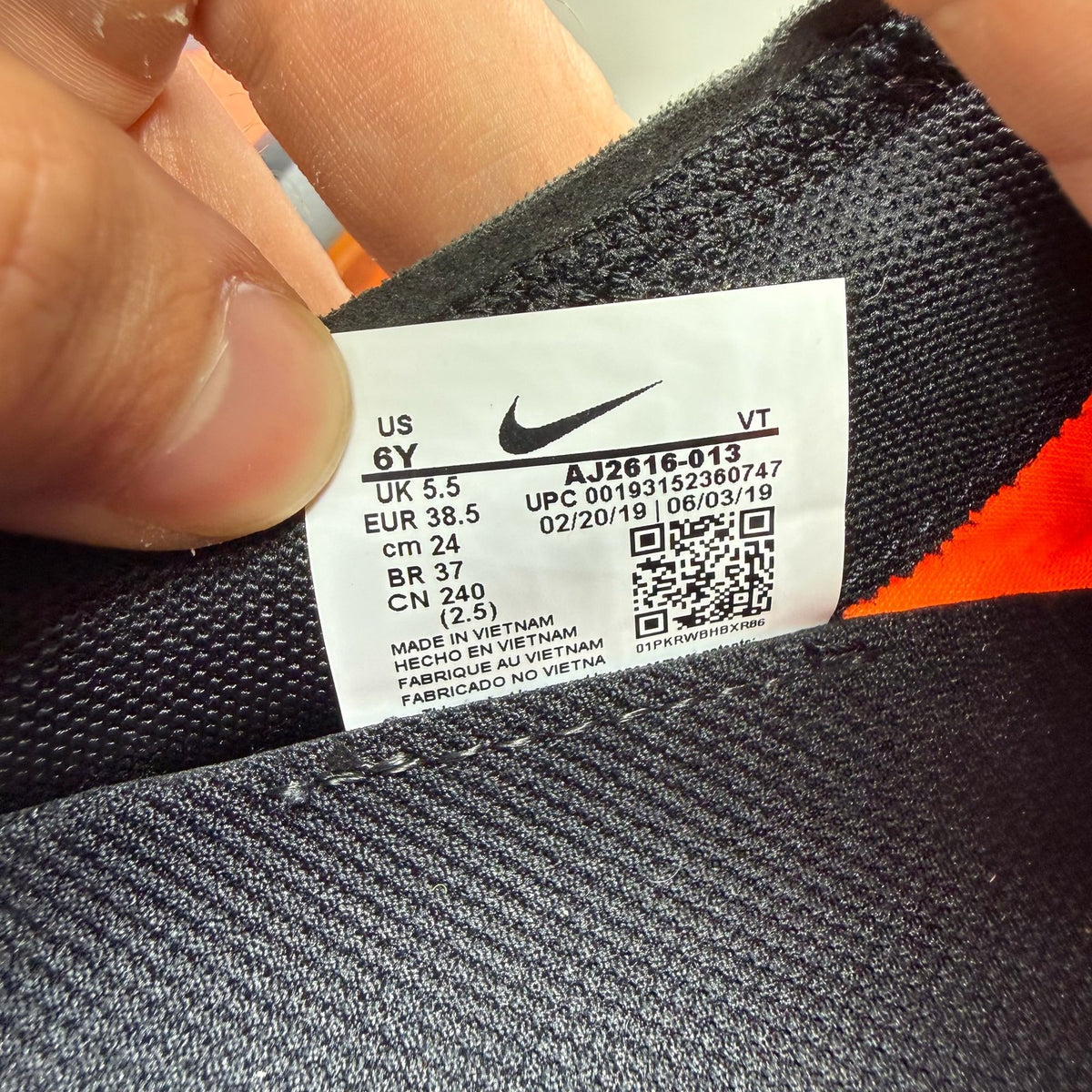 Nike grey trainers with total orange accents and Air VaporMax cushioning.