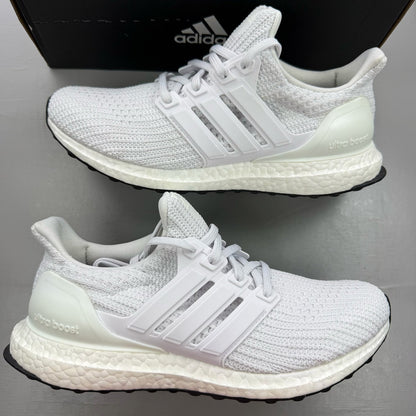 Adidas Ultra Boost 4.0 DNA white trainers with black accents and signature three-stripe logo.