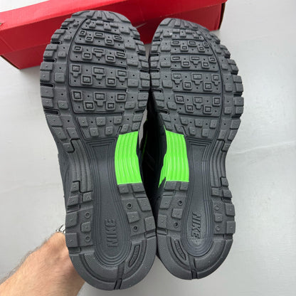 Nike P-6000 black trainers with green accents and mesh panels, 100% authentic.