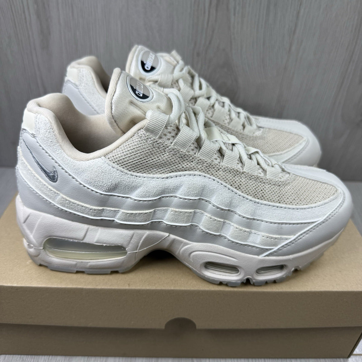 Nike Air Max 95 OG trainers beige with big bubble sole and logo detailing.