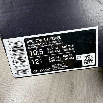 Nike black Air Force 1 Low trainers with jewel swoosh logo and grey accents.