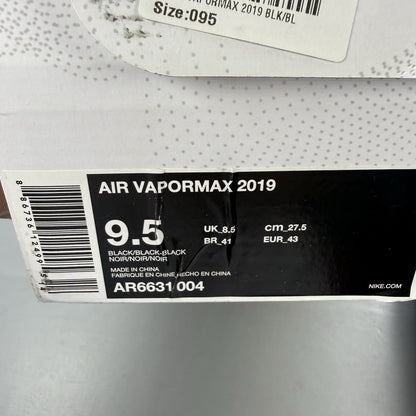 Nike Air VaporMax 2019 black trainers with grey accents and transparent sole design.